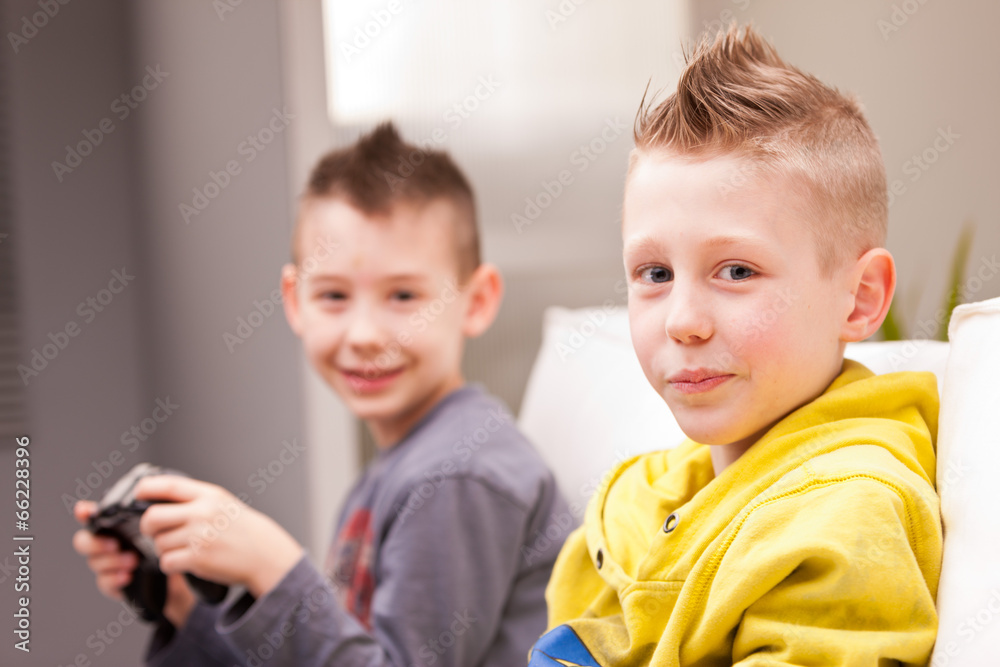 two kids playing video games