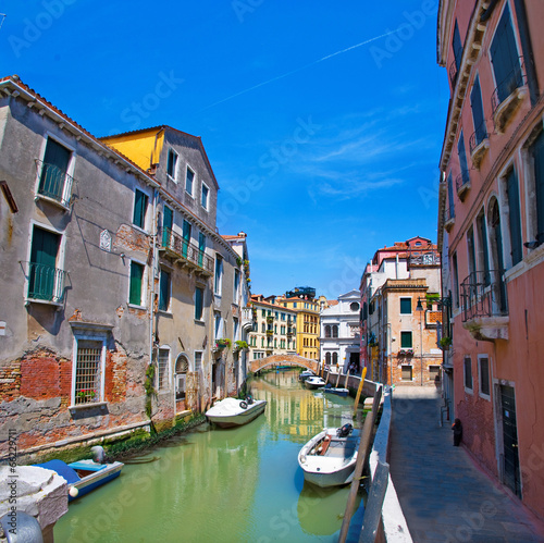 Venice canal, bridge, houses and the boats