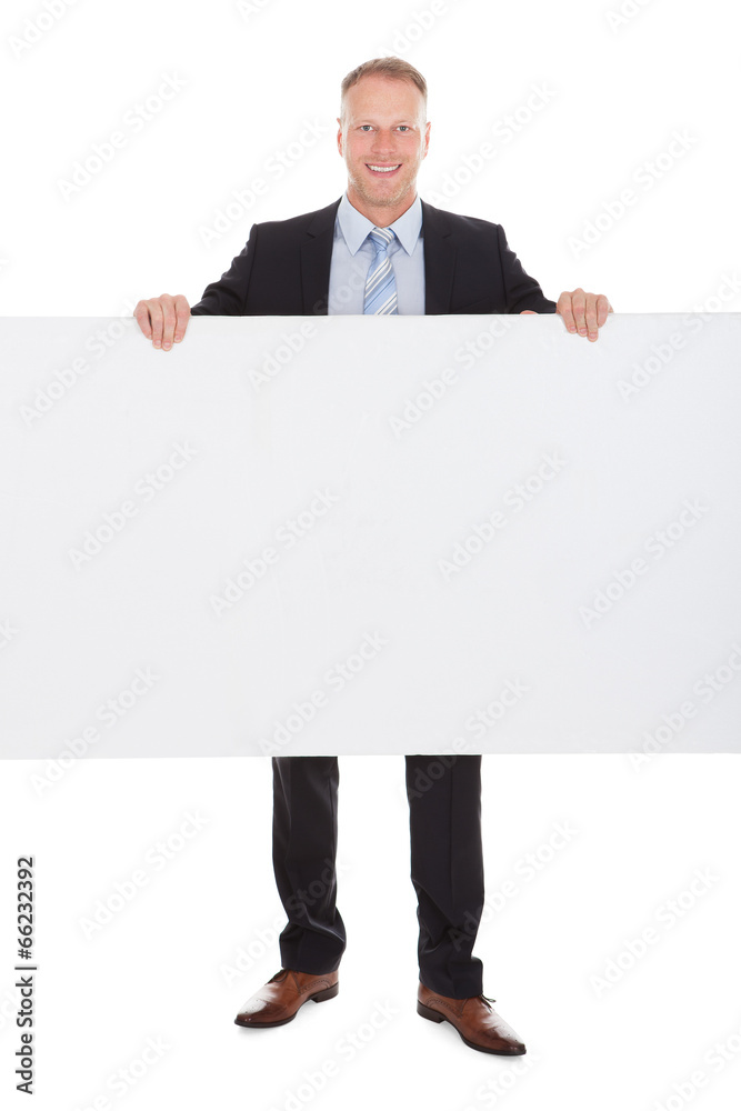 Confident Businessman Showing Billboard Confident Businessman Showing Billboard