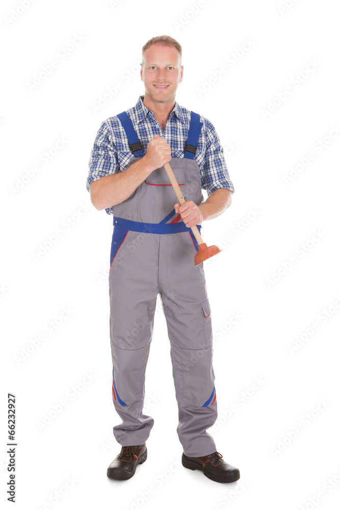 Excited Young Male Plumber Holding Plunger Excited Young Male Plumber Holding Plunger