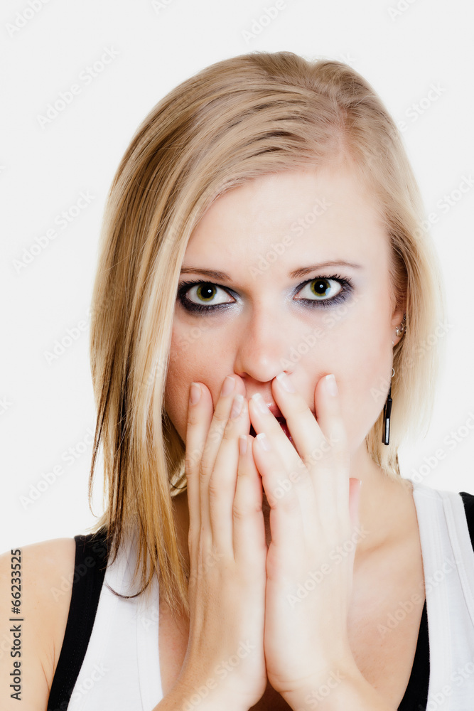 Surprised afraid girl covering mouth with hand Surprised afraid girl covering mouth with hand