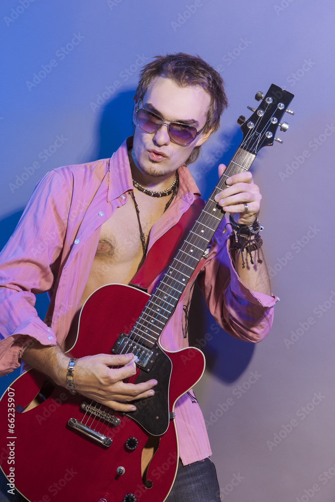Naklejka premium Portrait of the Man with the Guitar