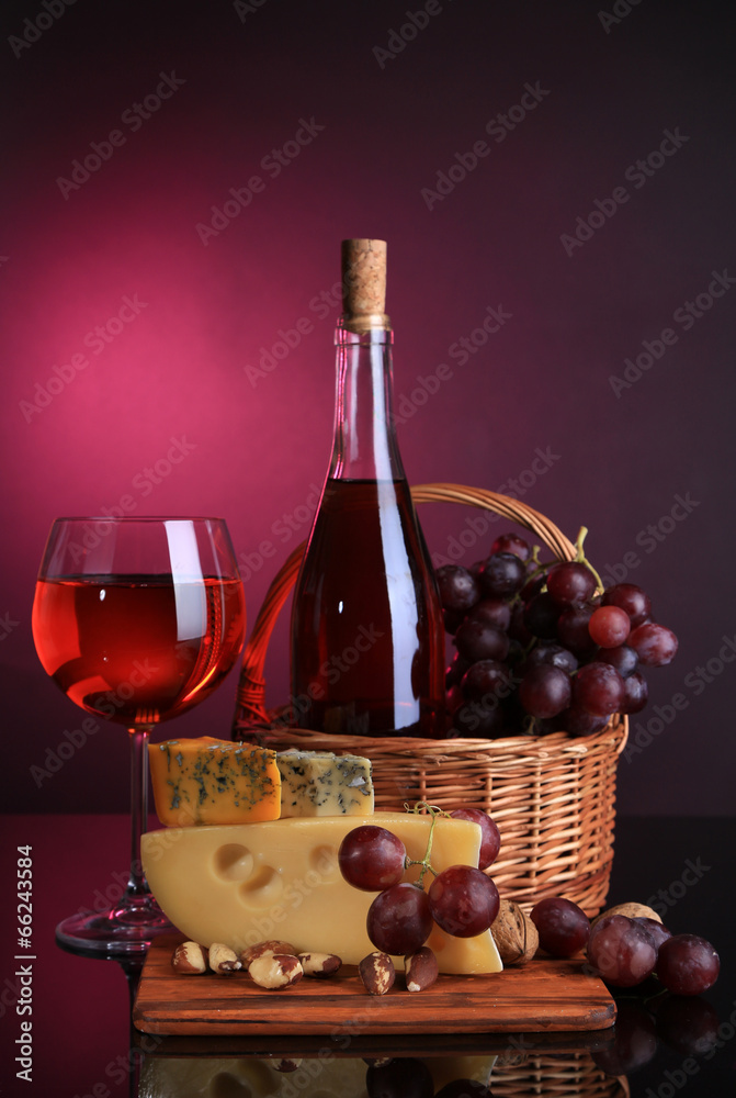 Pink wine, grapes and cheese on colorful background Pink wine, grapes and cheese on colorful background