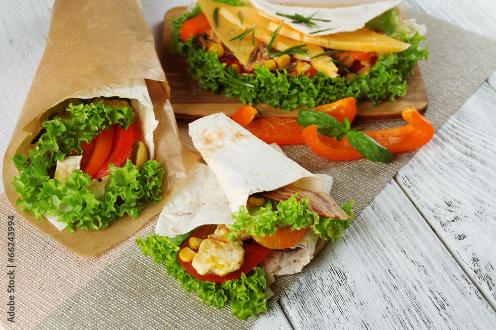 Veggie wrap filled with chicken and fresh vegetables