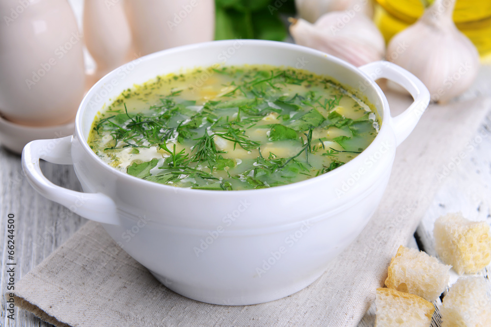 Delicious green soup with sorrel on table close-up Delicious green soup with sorrel on table close-up