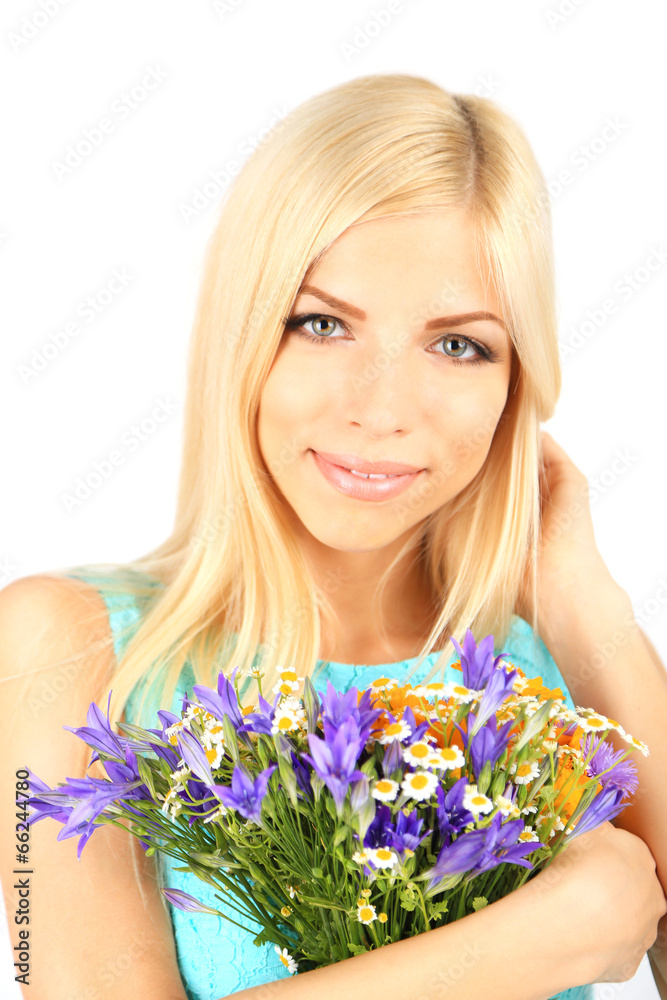 Young beautiful woman with flowers close up Young beautiful woman with flowers close up