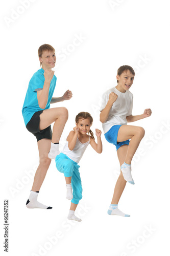 Boys and girl training karate