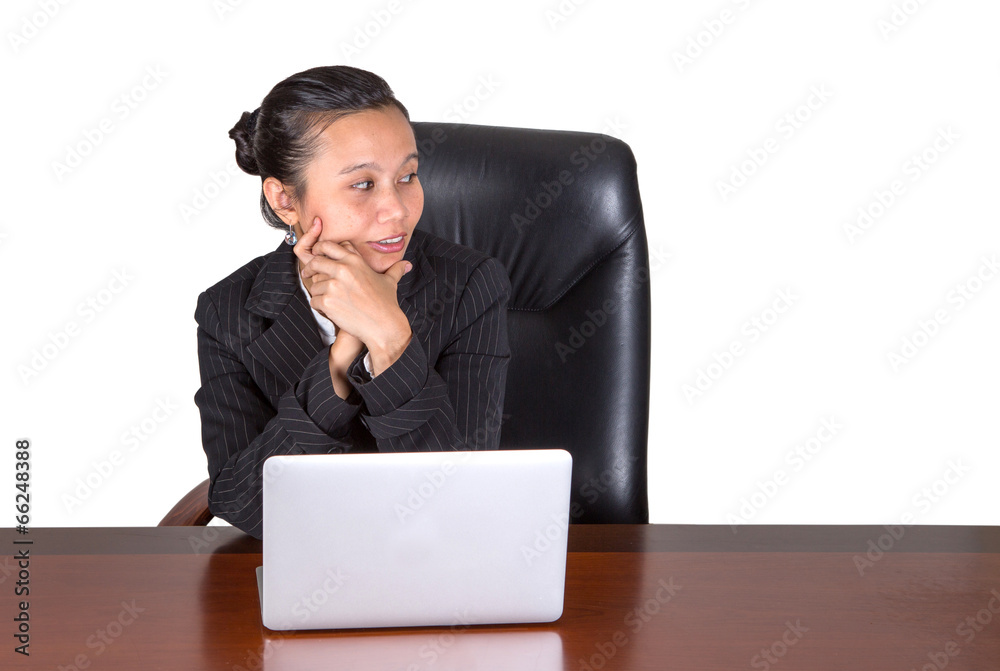 Asian businesswoman at her office desk over white background Asian businesswoman at her office desk over white background