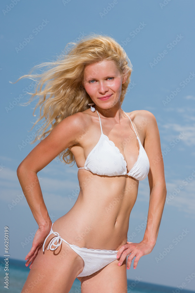 woman in bikini on sea background woman in bikini on sea background