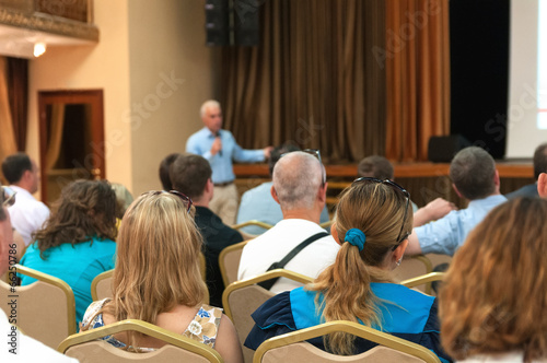 people sitting rear at the business conference and speaker