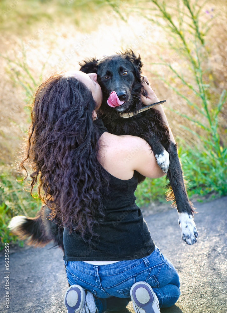 Dog on a woman shoulders Dog on a woman shoulders