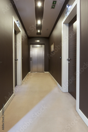 Interior of a corridor with a view to elevator door 