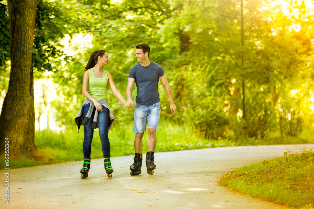 Lovers in nature on rollerblades Lovers in nature on rollerblades