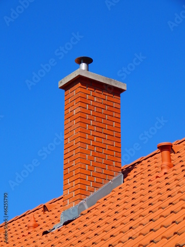 chimney in bright tile roof  with brick sunlight