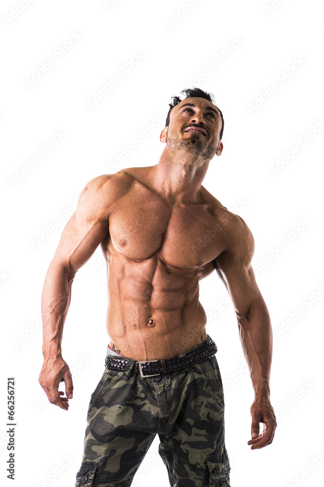 Frontal shot of shirtless muscular young man in military pants Frontal shot of shirtless muscular young man in military pants