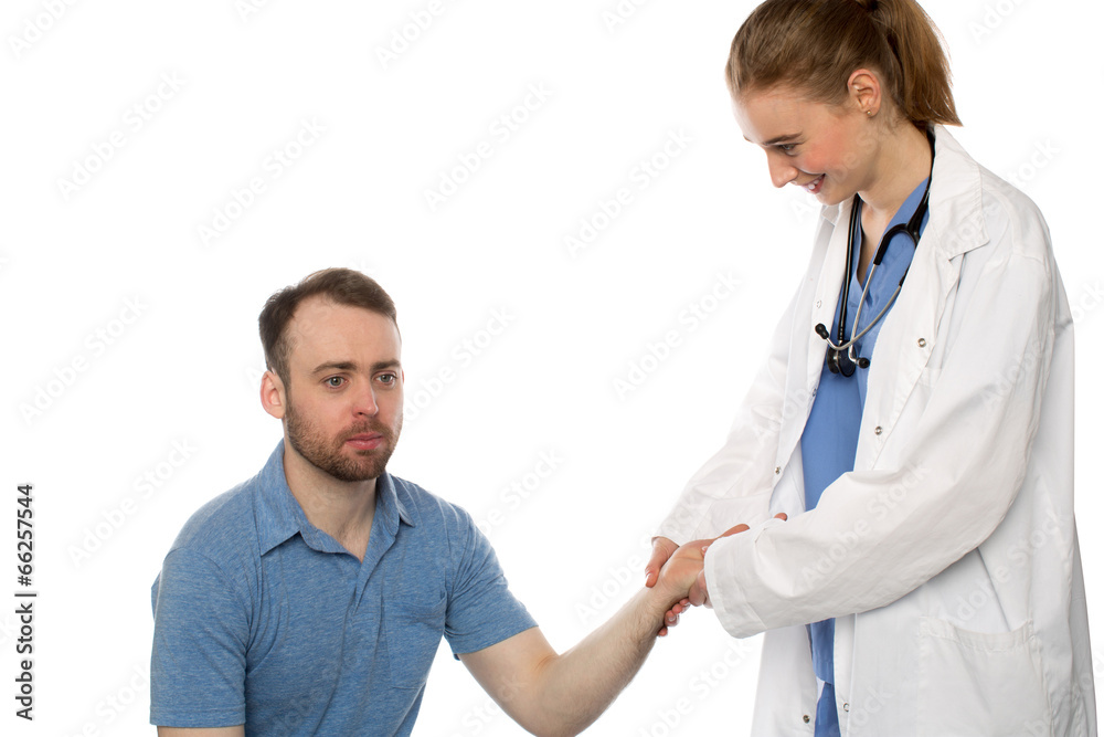Smiling Woman Doctor Checking Pulse of Patient Smiling Woman Doctor Checking Pulse of Patient
