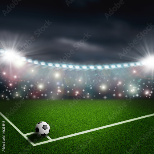 soccer ball on the green field corner