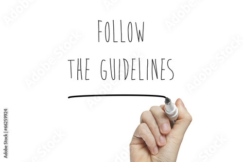 Hand writing follow the guidelines photo