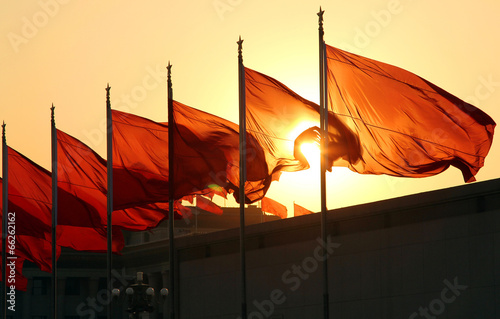red flags at sunrise