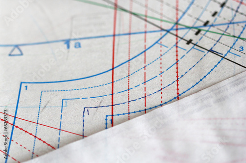 Sewing drawing and tracing paper laying on the table