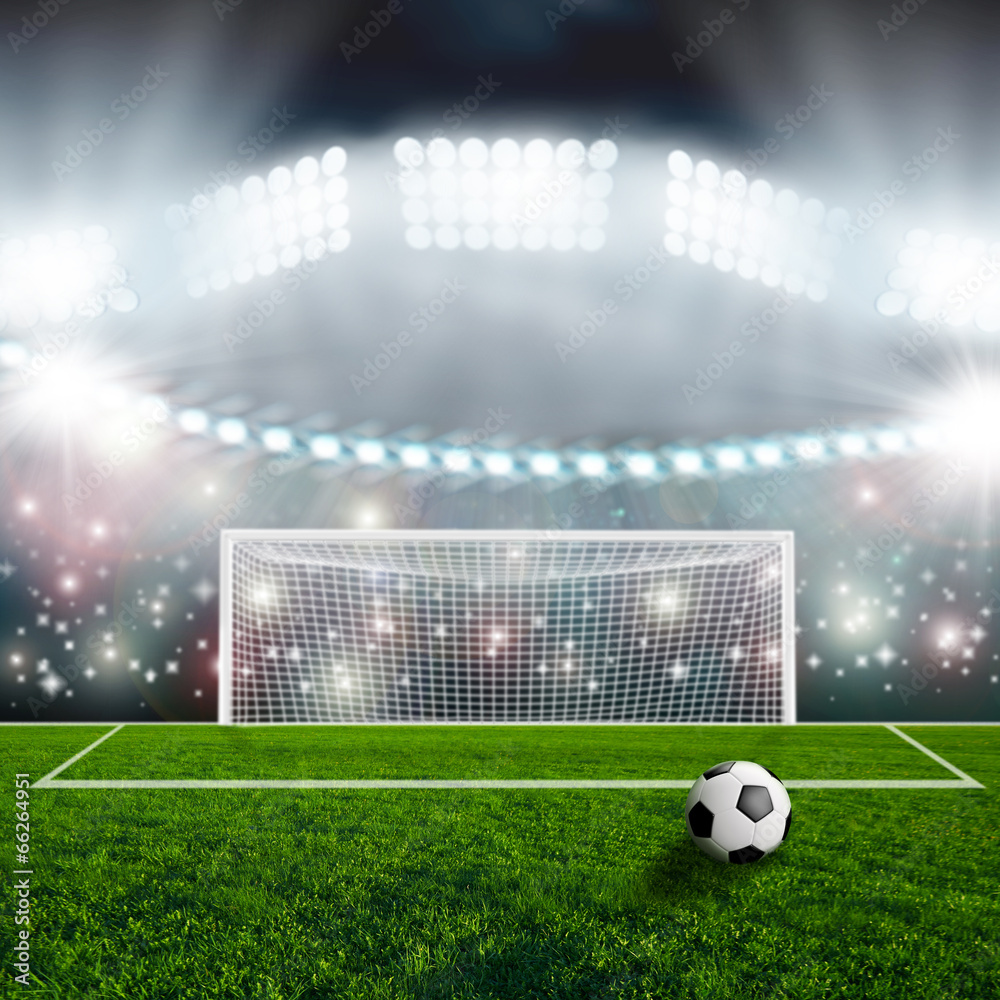 Fototapeta premium Soccer ball on green stadium arena
