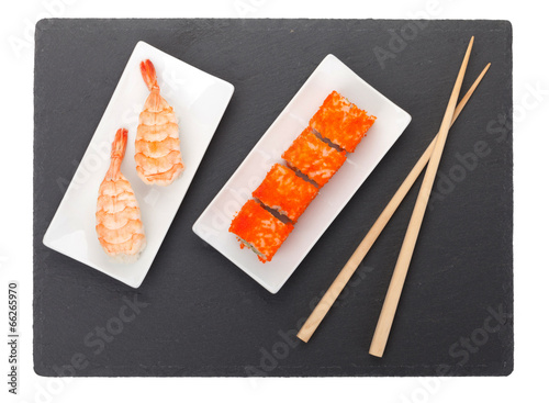 Sushi maki and shrimp sushi on black stone