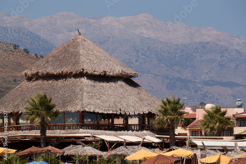 Thatched roof summer cafe on the beach
