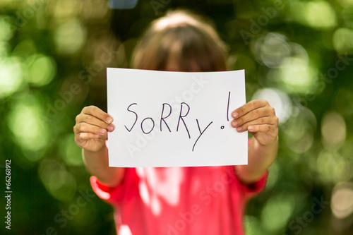 Girl with Sorry sign photo