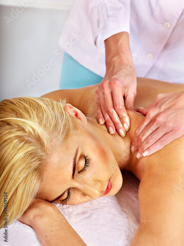 Woman getting facial massage .