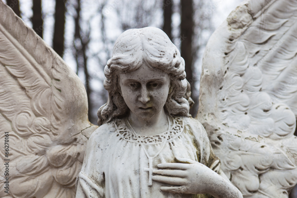 Old cemetery marble sculpture of the angel