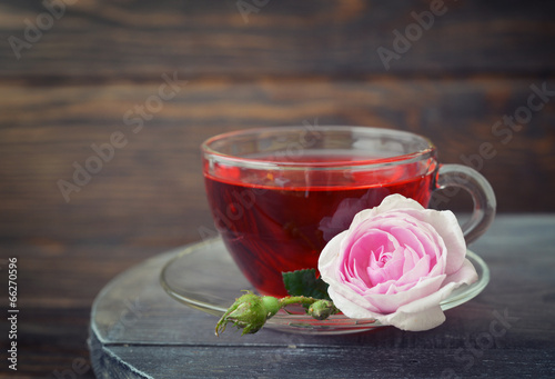 Tea rose flowers and tea photo