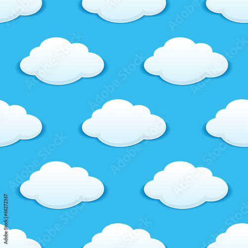 White fluffy clouds in a blue sky seamless pattern