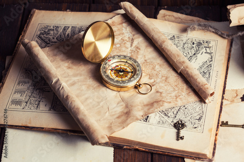 compass and old map on wooden table