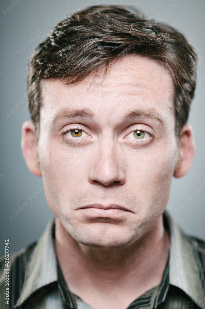 Caucasian man with a pouting expression Caucasian man with a pouting expression