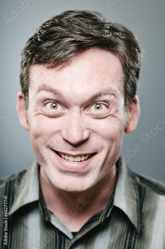 Caucasian man with a crazed expression