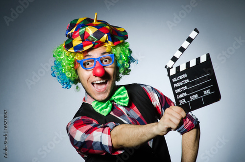 Clown with the movie board