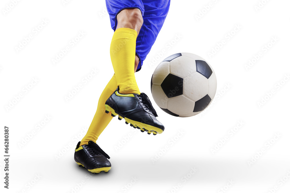 Football player kicking the ball Football player kicking the ball