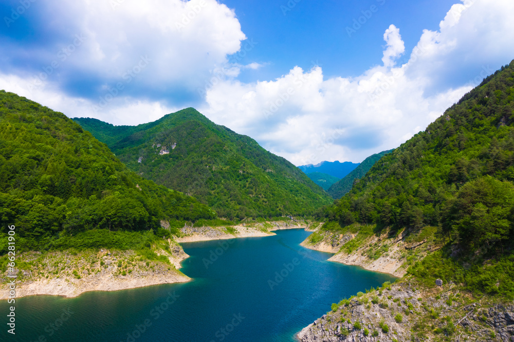Mountain lake. Beautiful landscape with lake, forest and mounta Mountain lake. Beautiful landscape with lake, forest and mounta