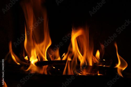 Fire in a fireplace  fire flames on a black background