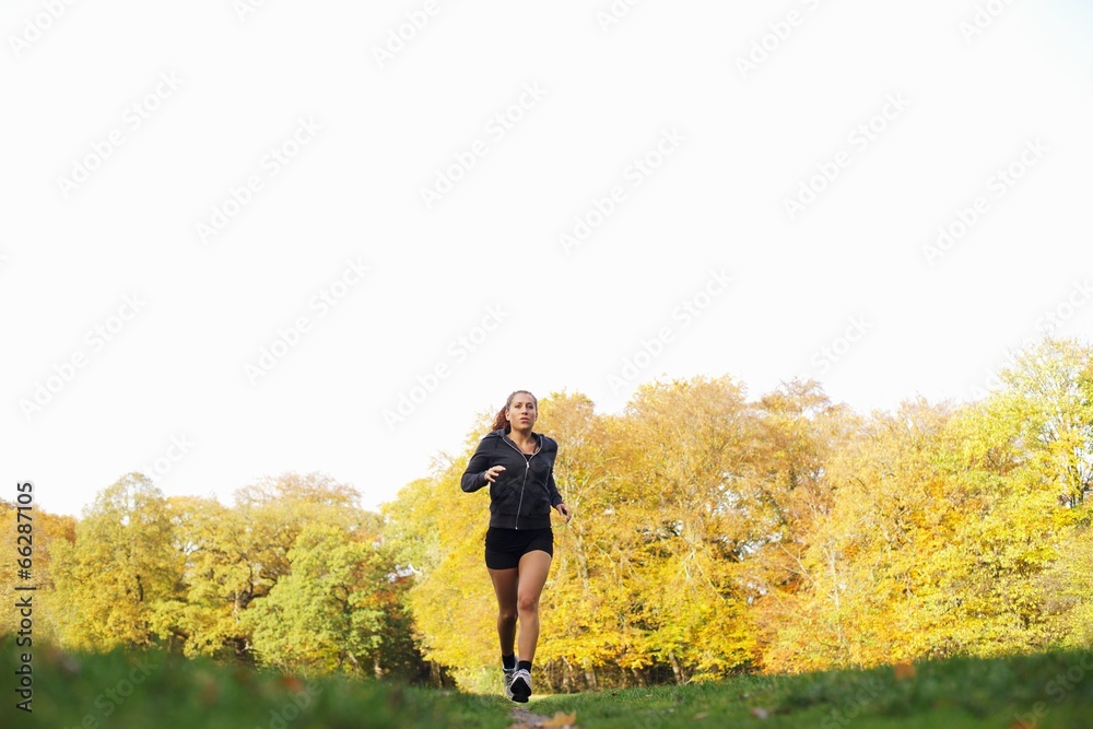 Fitness woman jogging in park