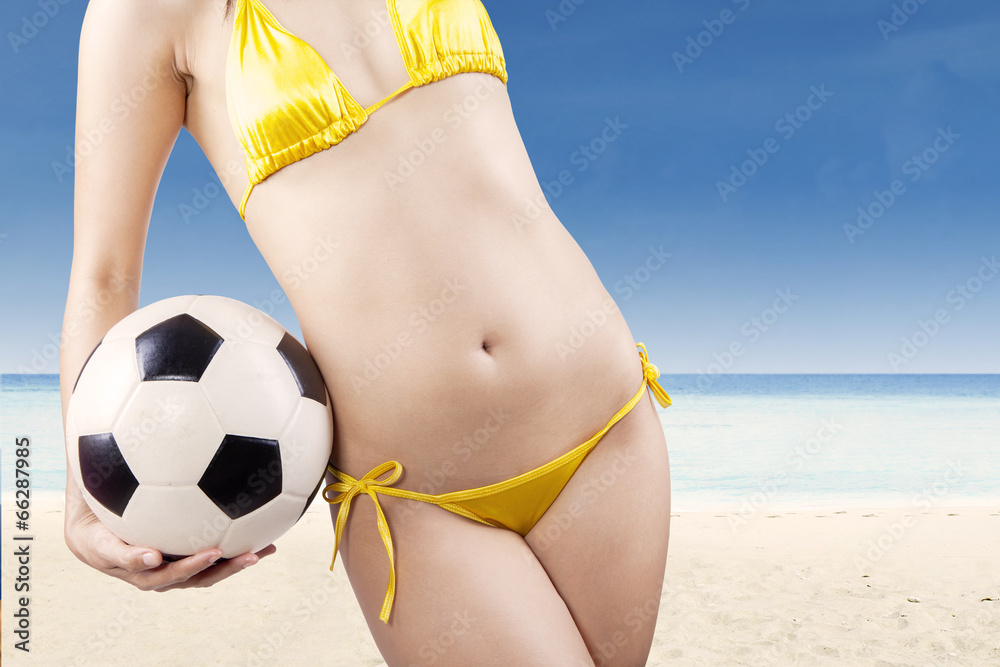 Fototapeta premium Soccer ball in woman hands