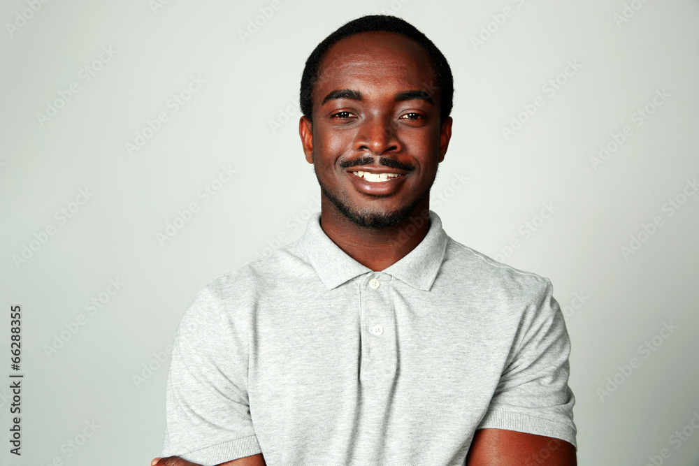 Portrait of a smiling african man on grya background Portrait of a smiling african man on grya background