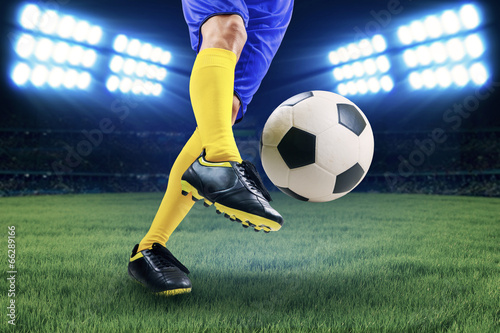 Soccer player kicking the ball