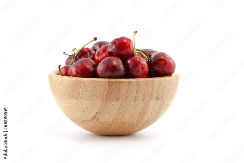 Bowl with ripe red cherries