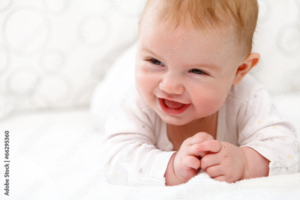 Smiling Baby Girl are Lying in the Bed Smiling Baby Girl are Lying in the Bed