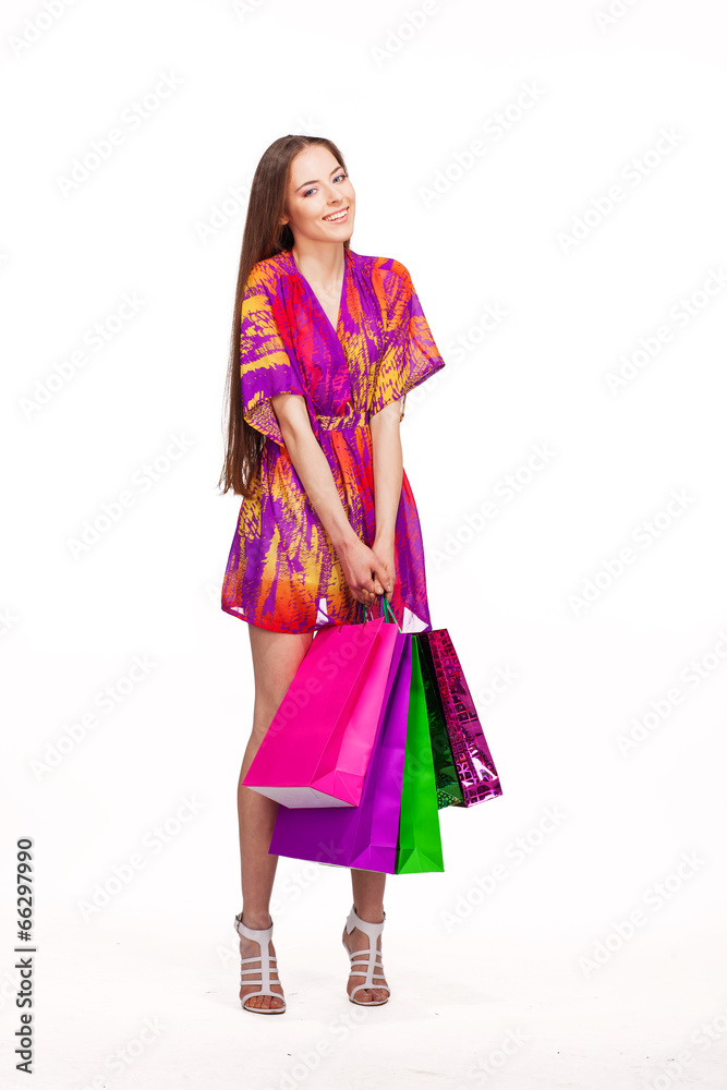 beautiful young happy smiling woman with shopping bags, isolated