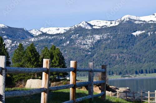 Wooden Fence and the Snow Covered Mountains