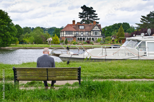 senior man sitting on a bench outdoor