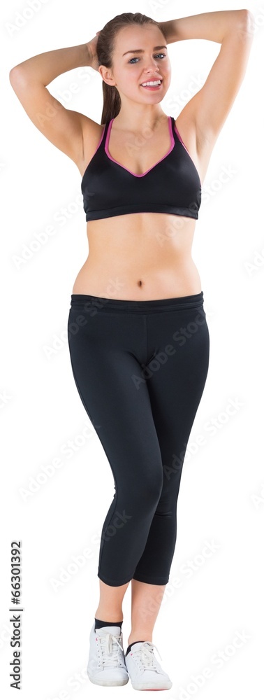 Fit brunette smiling at camera Fit brunette smiling at camera