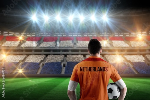 Composite image of netherlands football player holding ball © WavebreakmediaMicro